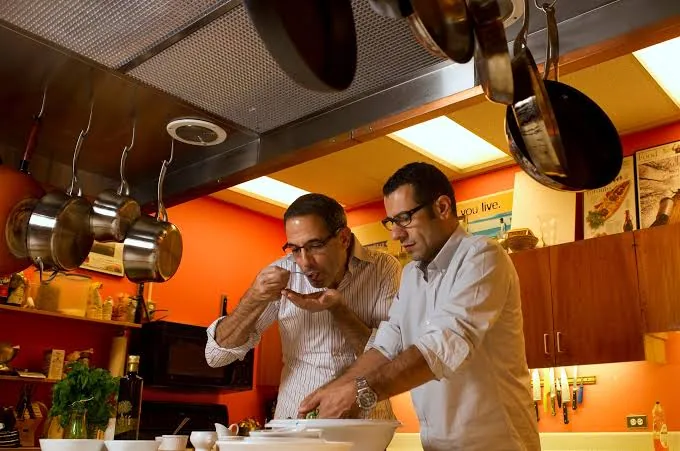 Chefs cooking together in a restaurant kitchen
